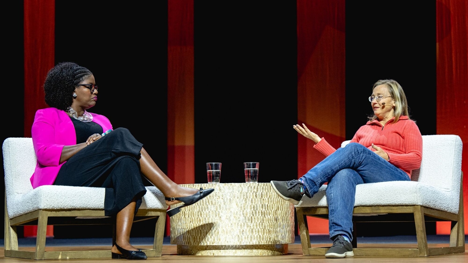 Two people in conversation on stage.